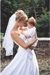 Bride carrying baby